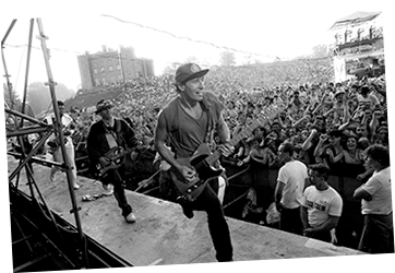 Bruce Springsteen running on stage